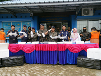 The Director General of Marine Resources and Fisheries Supervision (PSDKP), Pung Nugroho Saksono, and his staff give a press statement while...