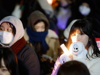 Thousands of citizens gather across from the National Assembly in Seoul, South Korea, on December 11, 2024, to call for the impeachment of P...