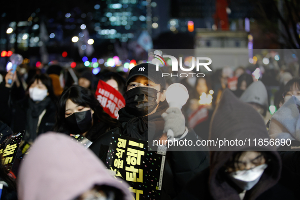 Thousands of citizens gather across from the National Assembly in Seoul, South Korea, on December 11, 2024, to call for the impeachment of P...