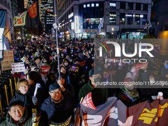 Thousands of citizens gather across from the National Assembly in Seoul, South Korea, on December 11, 2024, to call for the impeachment of P...