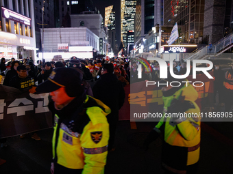 Thousands of citizens gather across from the National Assembly in Seoul, South Korea, on December 11, 2024, to call for the impeachment of P...