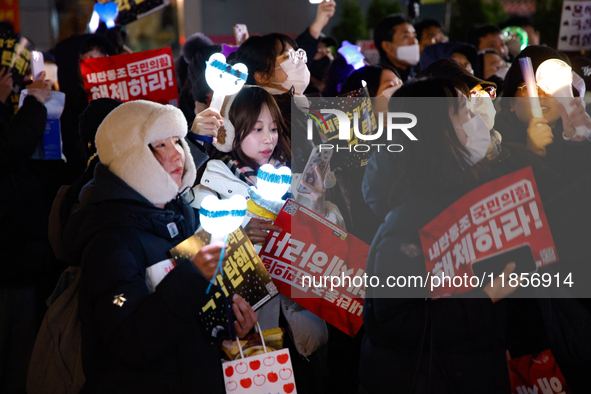 Thousands of citizens gather across from the National Assembly in Seoul, South Korea, on December 11, 2024, to call for the impeachment of P...