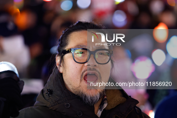 Thousands of citizens gather across from the National Assembly in Seoul, South Korea, on December 11, 2024, to call for the impeachment of P...