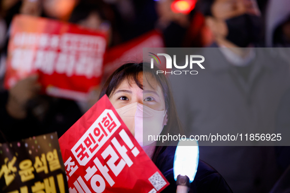 Thousands of citizens gather across from the National Assembly in Seoul, South Korea, on December 11, 2024, to call for the impeachment of P...