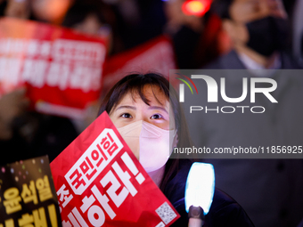 Thousands of citizens gather across from the National Assembly in Seoul, South Korea, on December 11, 2024, to call for the impeachment of P...