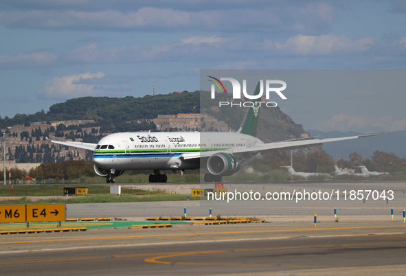 A Boeing 787-10 Dreamliner from Saudia is on the runway after landing at Barcelona El Prat Airport in Barcelona, Spain, on October 8, 2024. 