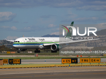 A Boeing 787-10 Dreamliner from Saudia is on the runway after landing at Barcelona El Prat Airport in Barcelona, Spain, on October 8, 2024....