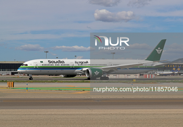 A Boeing 787-10 Dreamliner from Saudia is on the runway after landing at Barcelona El Prat Airport in Barcelona, Spain, on October 8, 2024. 