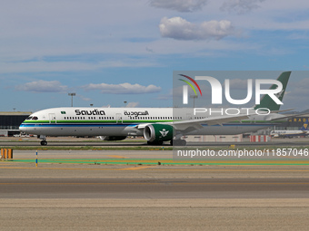 A Boeing 787-10 Dreamliner from Saudia is on the runway after landing at Barcelona El Prat Airport in Barcelona, Spain, on October 8, 2024....