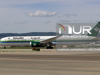 A Boeing 787-10 Dreamliner from Saudia is on the runway after landing at Barcelona El Prat Airport in Barcelona, Spain, on October 8, 2024....