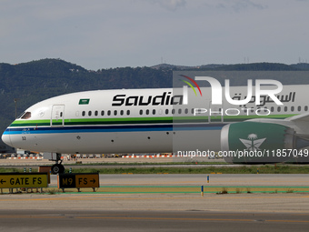 A Boeing 787-10 Dreamliner from Saudia is on the runway after landing at Barcelona El Prat Airport in Barcelona, Spain, on October 8, 2024....