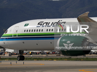 A Boeing 787-10 Dreamliner from Saudia is on the runway after landing at Barcelona El Prat Airport in Barcelona, Spain, on October 8, 2024....