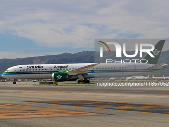 A Boeing 787-10 Dreamliner from Saudia is on the runway after landing at Barcelona El Prat Airport in Barcelona, Spain, on October 8, 2024....