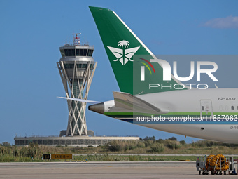 A Boeing 787-10 Dreamliner from Saudia is on the runway after landing at Barcelona El Prat Airport in Barcelona, Spain, on October 8, 2024....