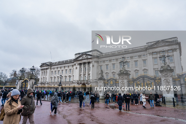 Visitors gather outside Buckingham Palace, in London, United Kingdom, on December 7, 2024. 