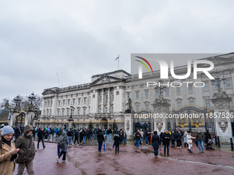 Visitors gather outside Buckingham Palace, in London, United Kingdom, on December 7, 2024. (