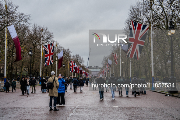 People walk along The Mall toward Buckingham Palace, in London, United Kingdom, on December 7, 2024 