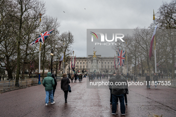 People walk along The Mall toward Buckingham Palace, in London, United Kingdom, on December 7, 2024 