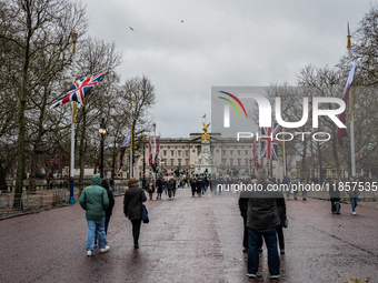 People walk along The Mall toward Buckingham Palace, in London, United Kingdom, on December 7, 2024 (