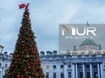 People gather around the Christmas tree at Somerset House, in London, United Kingdom, on December 7, 2024 (