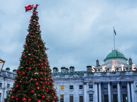 People gather around the Christmas tree at Somerset House, in London, United Kingdom, on December 7, 2024 (