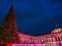 People admire the Christmas tree at Somerset House, in London, United Kingdom, on December 7, 2024 (