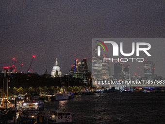 A view of the Thames River and the London skyline at night, in London, United Kingdom, on December 7, 2024. (