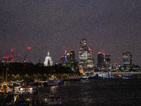 A view of the Thames River and the London skyline at night, in London, United Kingdom, on December 7, 2024. (