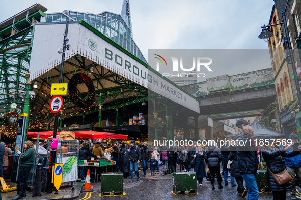 Shoppers explore the bustling Borough Market, in London, United Kingdom, on December 8, 2024 