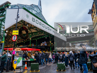 Shoppers explore the bustling Borough Market, in London, United Kingdom, on December 8, 2024 (