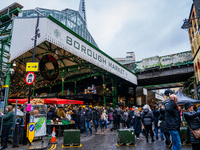 Shoppers explore the bustling Borough Market, in London, United Kingdom, on December 8, 2024 (