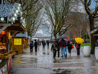 Visitors walk with umbrellas along a wet South Bank during Storm Darragh on December 7, 2024, in London, United Kingdom. London's Royal Park...