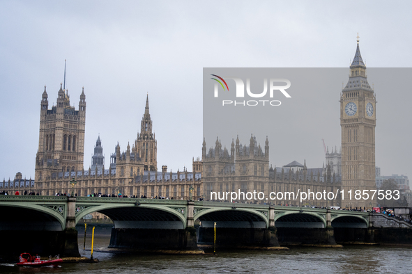 The Houses of Parliament and Big Ben under overcast skies during Storm Darragh on December 7, 2024, in London, United Kingdom. London's Roya...