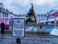 A sign at Somerset House announces the closure of the skating rink due to severe weather caused by Storm Darragh on December 7, 2024, in Lon...