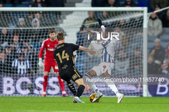 Josh Maja of WBA is in attacking action as Ben Sheaf of Coventry moves to intercept during the Sky Bet Championship match between West Bromw...