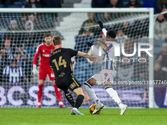 Josh Maja of WBA is in attacking action as Ben Sheaf of Coventry moves to intercept during the Sky Bet Championship match between West Bromw...