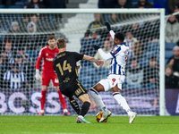 Josh Maja of WBA is in attacking action as Ben Sheaf of Coventry moves to intercept during the Sky Bet Championship match between West Bromw...