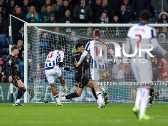 Number 18, Karlan Grant of WBA attempts a shot on goal as half-time approaches during the Sky Bet Championship match between West Bromwich A...