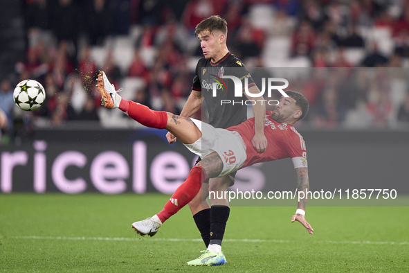 Nicolas Otamendi of SL Benfica competes for the ball with Thijs Dallinga of Bologna Football Club 1909 during the UEFA Champions League matc...