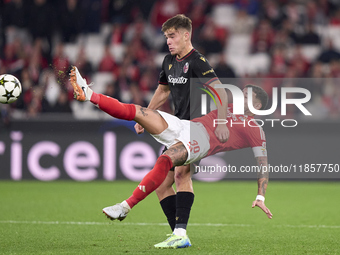 Nicolas Otamendi of SL Benfica competes for the ball with Thijs Dallinga of Bologna Football Club 1909 during the UEFA Champions League matc...