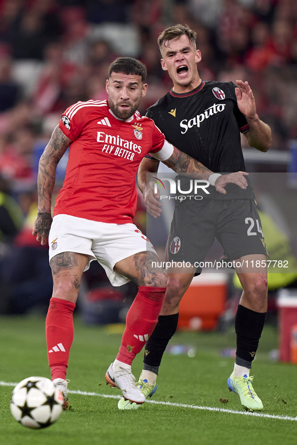 Nicolas Otamendi of SL Benfica competes for the ball with Thijs Dallinga of Bologna Football Club 1909 during the UEFA Champions League matc...