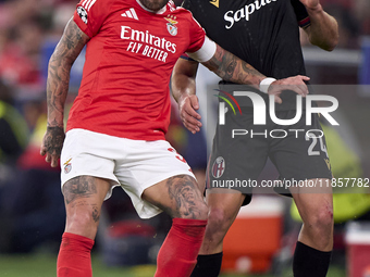 Nicolas Otamendi of SL Benfica competes for the ball with Thijs Dallinga of Bologna Football Club 1909 during the UEFA Champions League matc...