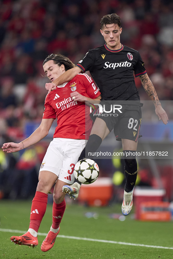 Kacper Urbanski of Bologna Football Club 1909 competes for the ball with Alvaro Carreras of SL Benfica during the UEFA Champions League matc...