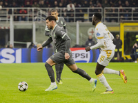 Theo Hernandez plays during the UEFA Champions League 2024/25 match between AC Milan and FK Crvena Zvezda at Giuseppe Meazza stadium in Mila...