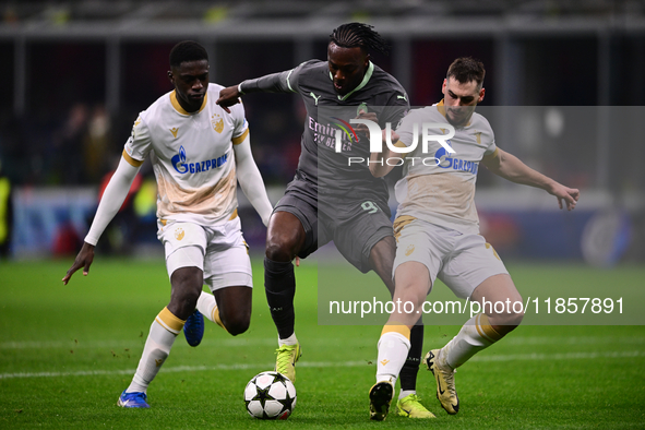 Tammy Abraham of AC Milan and Ivan Gutesa of FK Crvena Zvezda battle for the ball during the UEFA Champions League match between AC Milan an...