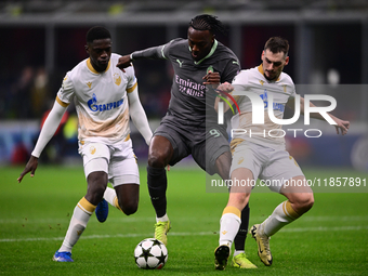 Tammy Abraham of AC Milan and Ivan Gutesa of FK Crvena Zvezda battle for the ball during the UEFA Champions League match between AC Milan an...