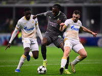 Tammy Abraham of AC Milan and Ivan Gutesa of FK Crvena Zvezda battle for the ball during the UEFA Champions League match between AC Milan an...