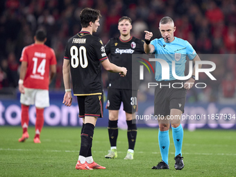 Referee Radu Petrescu reacts during the UEFA Champions League match between SL Benfica and Bologna FC 1909 at Estadio Da Luz in Lisbon, Port...