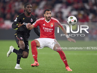 Samuel Iling-Junior of Bologna Football Club 1909 competes for the ball with Vangelis Pavlidis of SL Benfica during the UEFA Champions Leagu...