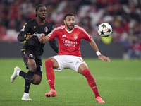 Samuel Iling-Junior of Bologna Football Club 1909 competes for the ball with Vangelis Pavlidis of SL Benfica during the UEFA Champions Leagu...